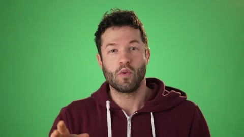Close up head shot portrait man applicant on green screen chroma key wave hand Stock Footage 149493178