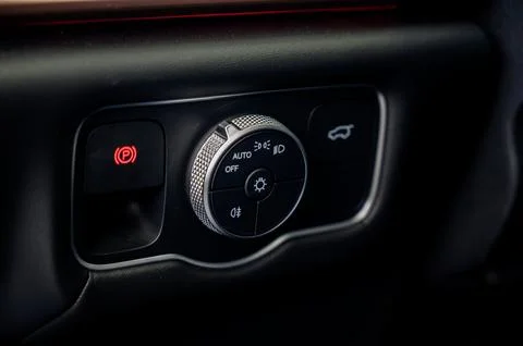 Close-up of the headlight setting buttons. Stock Photos