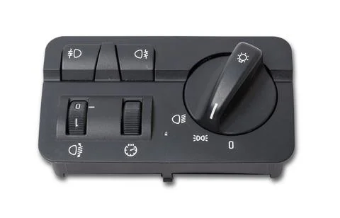 Close-up on the headlight switch control buttons and automatic adjust level d Stock Photos