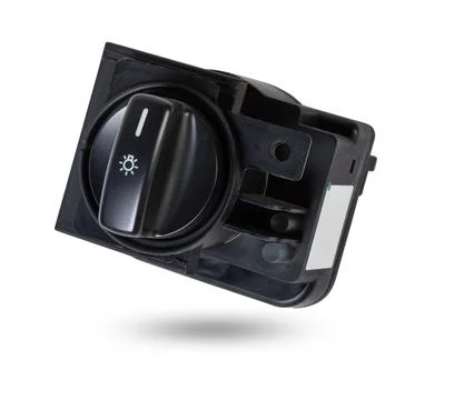 Close-up on the headlight switch control buttons and automatic adjust level d Stock Photos