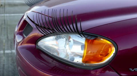 Close up headlights of car with eyelash with 4k resolution Stock Footage 61870407