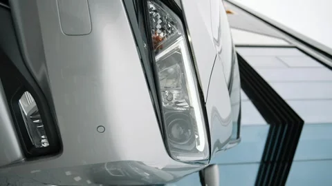 Close up of headlights of modern car. New auto headlamp Stock-Footage 241420348
