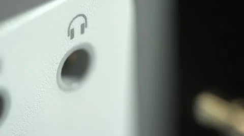 Close up of headphone jack being plugged in Stock Footage 10944601