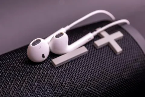Close-up headphone stack on black background, modern speaker earbuds device a Stock Photos