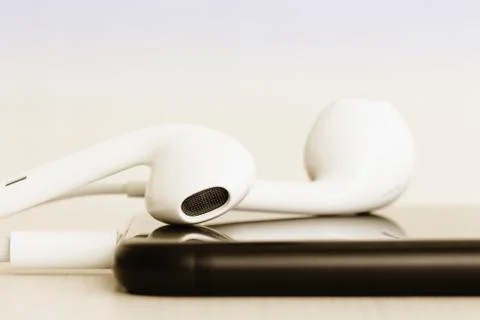 Close-up headphone stack on phone Stock Photos