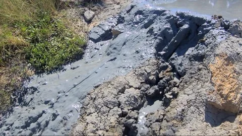 Close up Healing mud flows beautifully like a stream from the crater. Mud volcan Stock Footage 301466872