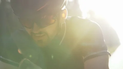 Close-up of healthy man doing workout on a bike outdoors Stock Footage 75399183