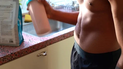 Close up of healthy man at home preparing protein shake- 8 sec Stock Footage 126767754