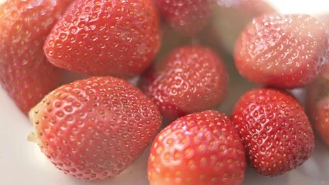Close-up heap of fresh fragrant red strawberry surrounded by summer light Video stock 100085245