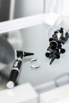 Close-up of hearing clinic tools, featuring an otoscope and ear tips for ex.. 写真素材