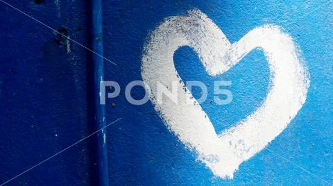 Close up of heart painted on blue wall Stock Photos