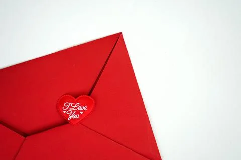 Close up of heart shape in a brown envelope on white background Stock Photos