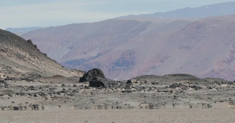 Close up of heat haze effect on black bed of lava floor. Desert color mountains 스톡 동영상 103469251