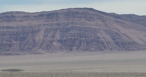Close up of heat haze effect on desert floor. Mountains at background 스톡 동영상 103467704