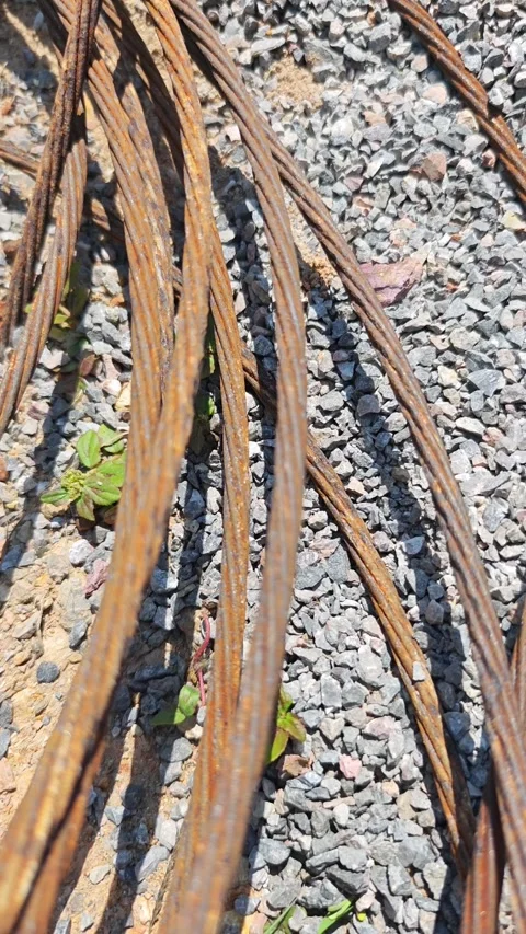 Close up of heavily rusted overhead ground wire on high voltage tower. Video stock 332930641