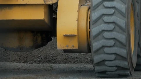 Close up of Heavy Equipment Tractor moving Gravel Rock. Stock Footage 90965013