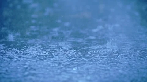 Close-up of heavy rain falling on the water surface, Severe thunderstorm 스톡 동영상 283066243