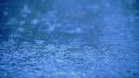 Close-up of heavy rain falling on the water surface, Severe thunderstorm Video stock 283066251