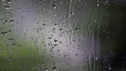 Close-up of heavy rain falling on window surface Stock Footage 109455160