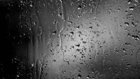 Close-up of heavy rain falling on window surface Stock Footage 109455300