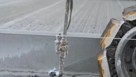 Close-up of heavy road construction machine spraying paint on concrete highway Stock Footage 158049887