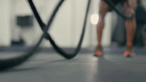 Close up of heavy ropes being used in the gym by personal trainer Stock Footage 89577503