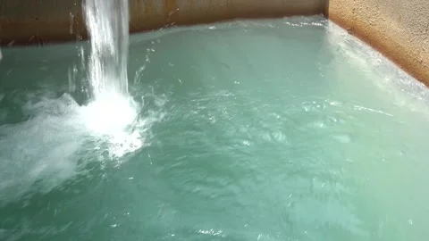 Close-Up of Heavy Water Flow Plunging into a Turquoise Concrete Basin Vídeos de archivo 334623361