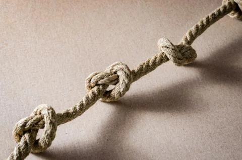 Close-up of  Hemp rope with multiple knots . Stock Photos