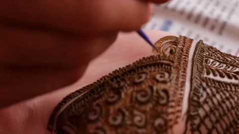Close up of Henna Tattoo Applying In Indian Wedding. Mehendi Ceremony Stock Footage 201250630
