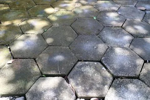Close-up of hexagonal stone pavement on outdoor ground Stock Photos