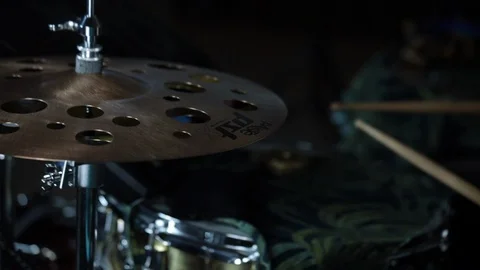 Close up of hi hat as drummer plays in the background 스톡 동영상 98760402