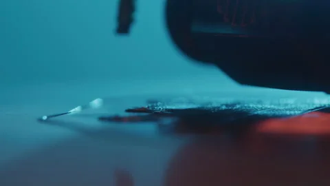 Close-up of Hi Tech 3d Printer Producing Print Under Blue Lighting Stock Footage 208801260