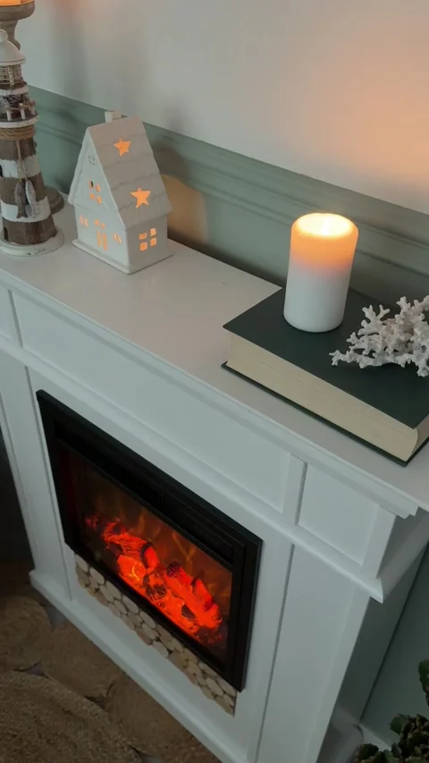 Close up high angle of fireplace mantel with candles and coastal home decor Vídeo Stock 346172351