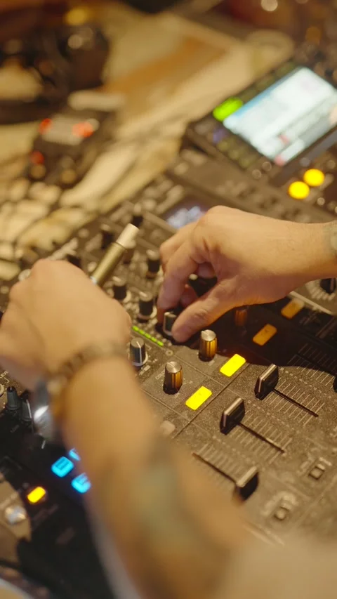 This is a close-up, high-angle shot capturing a DJ Stock Footage 329915012