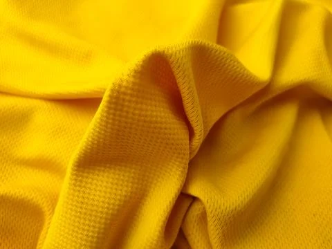 A close-up, high-angle shot featuring a bright yellow mesh fabric Stock Photos