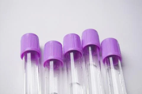 Close-up, high-angle shot of five empty medical blood collection tubes with.. Stock Photos