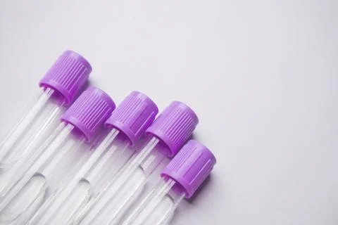 Close-up, high-angle shot of five empty medical blood collection tubes with.. Stock Photos