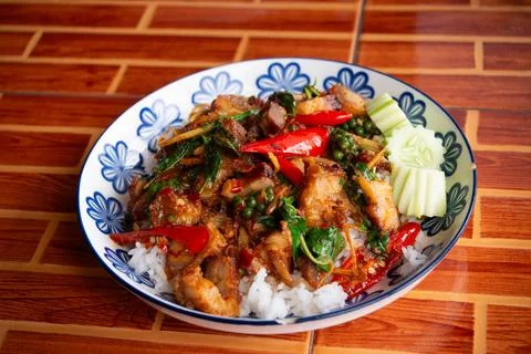 A close-up, high-angle shot of Pad Cha Moo Krob (spicy stir-fried crispy po.. Stock Photos