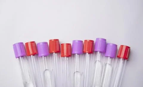 Close-up, high-angle shot of ten empty medical blood collection tubes with .. Stock Photos