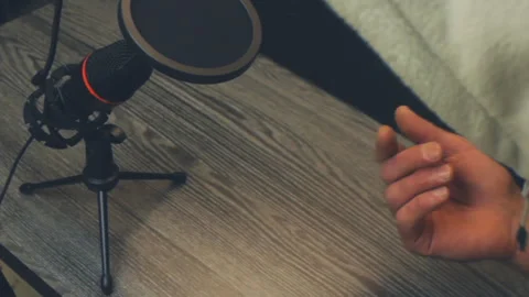 Close up high angle of unidentifiable man in hoodie gesturing while talking Video stock 333935873