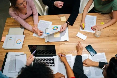 Close-up high-angle view of diverse businesswomen, businessmen and office Stock Photos