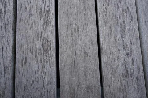 A close-up high-angle view of weathered grey wooden planks creating a textured 写真素材