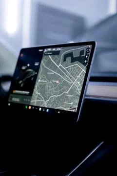 Close-up in high-class car on-board computer with city navigation checking for Foto stock