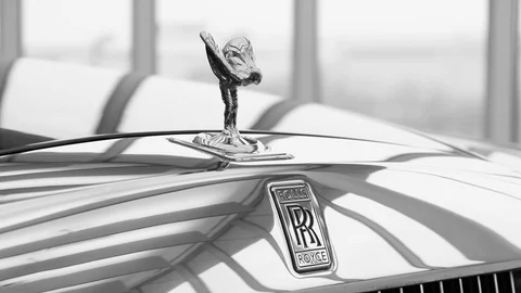 Close up high detailed view of Rolls-Royce emblem logo, Spirit of Ecstasy Stock Footage 113502072