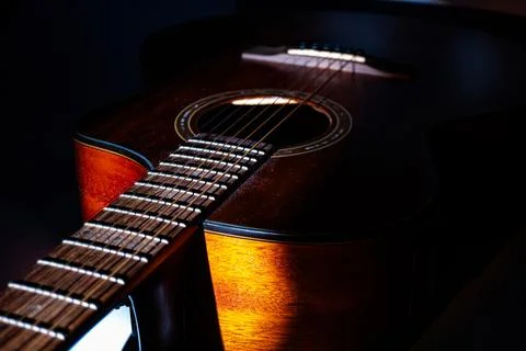 Close-up of a high-quality, six-string acoustic guitar possibly mahogany or.. 스톡 사진