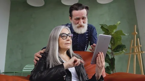Close up of high-spirited attractive modern mature woman and her bearded husband Stock Footage 125434953