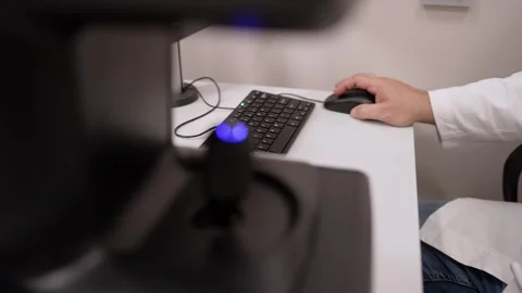 Close up on a high tech control joystick for medical equipment with a scientist Stock Footage 335642047