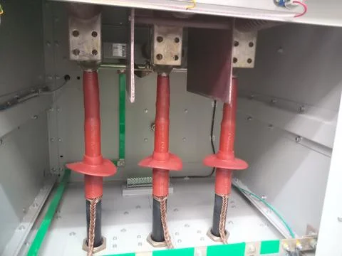 Close up of high voltage cable termination with red heat shrink tube. Stock Photos