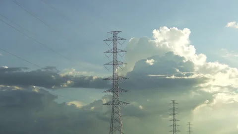 Close up of high voltage tower with dramatic moving clouds 库存影片 337639681
