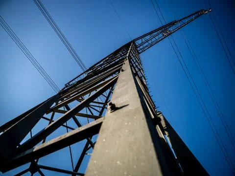 Close up of a high voltage tower/post with blue sky Stock Photos